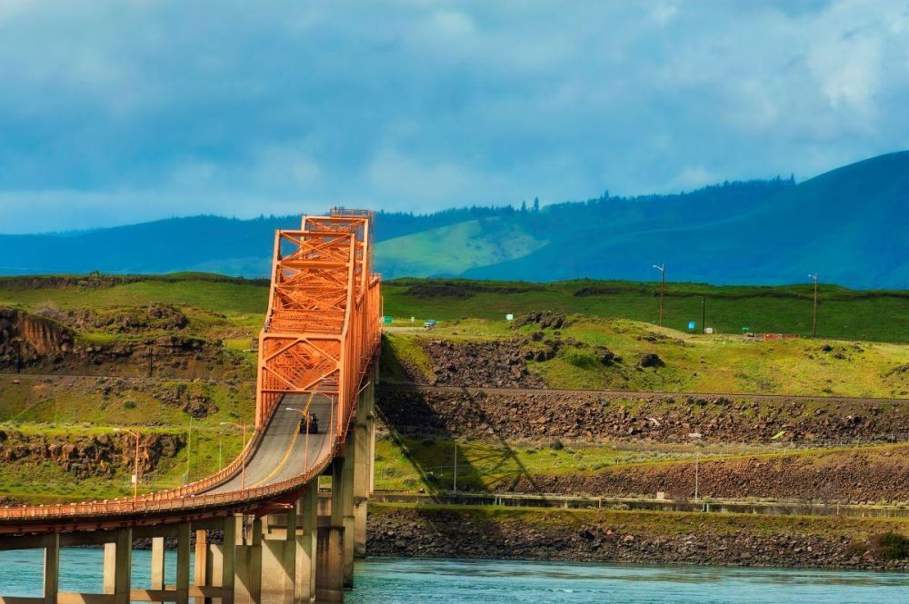 Washington state rises behind the The Dalles Bridge in the Columbia River Gorge.
